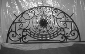 Making of a forged iron door and screenMaking of a forged iron transom window